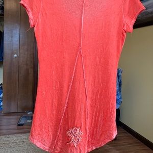 Beautiful orange shirt w/embellishments. Made in the U. S. Of 100% cotton.